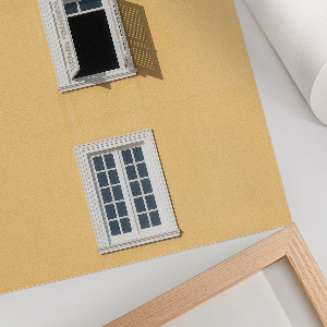 Wandposter mit Motiv einer gelben Fassade